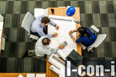 Three People Sitting Beside Table